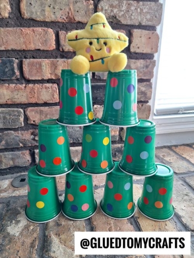 Use rainbow colored coding dot stickers and green cups to make a Christmas Tree stacking game