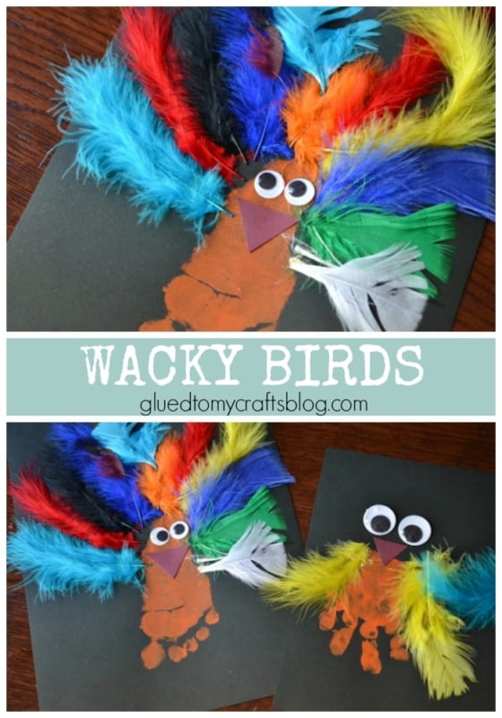 Two handmade Handprint Wacky Birds crafts made from brown painted footprints, colorful feathers for wings and tails, googly eyes, and orange paper beaks are displayed on black paper.