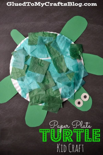 A paper plate turtle craft featuring a green tissue paper shell, green paper legs and head, and googly eyes. The text reads, Paper Plate Turtle Kid Craft—an adorable paper turtle project perfect for young crafters!.