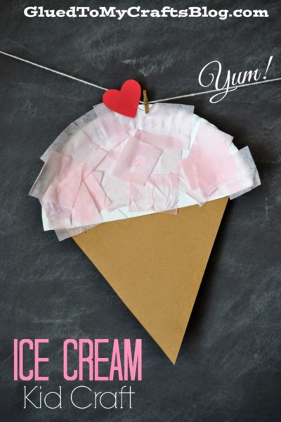 A paper ice cream kid craft with a brown cone and pink-and-white tissue "ice cream," topped with a red heart clothespin, hangs on a string. "Yum!" and "Ice Cream Kid Craft" are written on the chalkboard background, making it perfect for any paper plate ice cream themed activity.