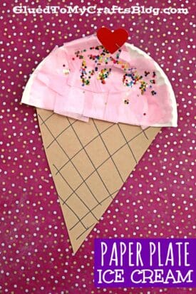 A fun ice cream kid craft featuring a paper plate ice cream cone with pink tissue, colorful sprinkles, and a red heart on a pink polka dot background. Text reads “Paper Plate Ice Cream.”.