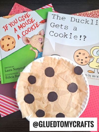 Two children’s books, If You Give a Mouse a Cookie and The Duckling Gets a Cookie!?, sit next to a Paper Plate Cookie kid craft. A @GLUEDTOMYCRAFTS label is at the bottom.