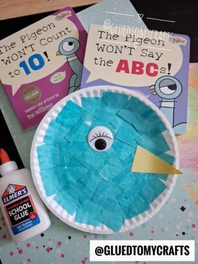 Children’s books The Pigeon Will Not Count to 10! and The Pigeon Won’t Say the ABCs! are featured alongside a charming Paper Plate Pigeon craft, created with blue tissue paper and glue. The @GLUEDTOMYCRAFTS tag is visible.