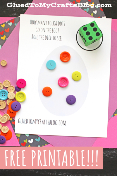 A printable egg-shaped game sheet with colorful buttons as polka dots, a green die, and scattered buttons on a pink paper background. A fun spring dice game: roll the die and see how many polka dots go on the egg!.