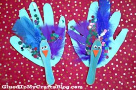 Scoop Stick Handprint Peacock Puppet - Kid Craft