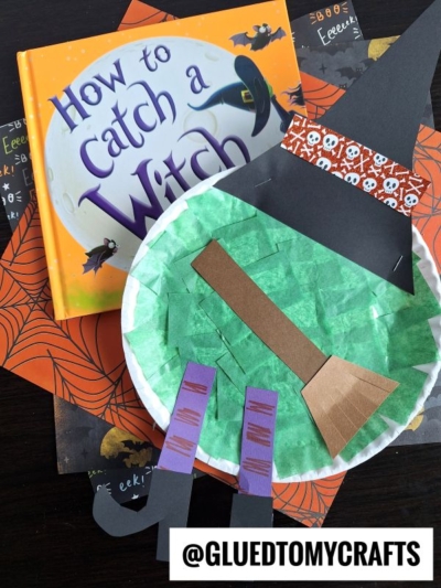 A children’s book titled “How to Catch a Witch” sits next to a paper plate melted witch craft resembling a witch’s face and hat, displayed on Halloween-themed paper. @GLUEDTOMYCRAFTS is written at the bottom.