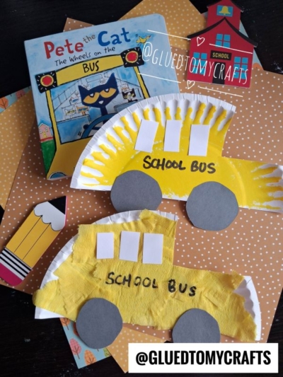 Two paper plate school bus crafts with SCHOOL BUS written on them, a Pete the Cat book, and orange polka-dot background with school-themed cutouts. These adorable paper plate bus creations make for a fun and easy school bus craft idea. @GLUEDTOMYCRAFTS watermark is present.