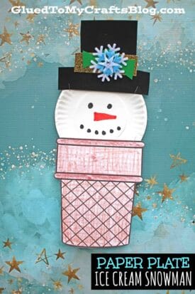 Create a whimsical ice cream cone snowman craft using a paper plate, complete with a top hat, drawn face, snowflake accent, and colorful cone. Set against a blue background with gold stars, it's perfect for winter fun!.