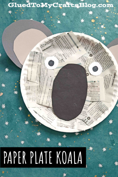 A paper plate newspaper koala face craft made with newspaper scraps and colored paper for the ears, nose, and eyes, set on a teal background with scattered white stars. Text reads “Paper Plate Koala.”.