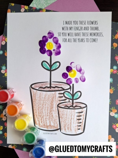A childrens craft page shows two flowerpots with fingerprint flowers made from purple and yellow thumbprints, surrounded by colorful paint pots. A message reads: I made you these flowers with my finger and thumb, so you will have these memories for all the years to come!.
