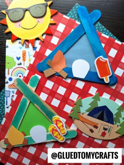 Colorful summer camp-themed crafts, like a Popsicle Stick Tent and campfires, are made from popsicle sticks, paper, and stickers. Arranged on a patterned background, the designs include tents, smores, sandals, a sun with sunglasses, and a cabin.