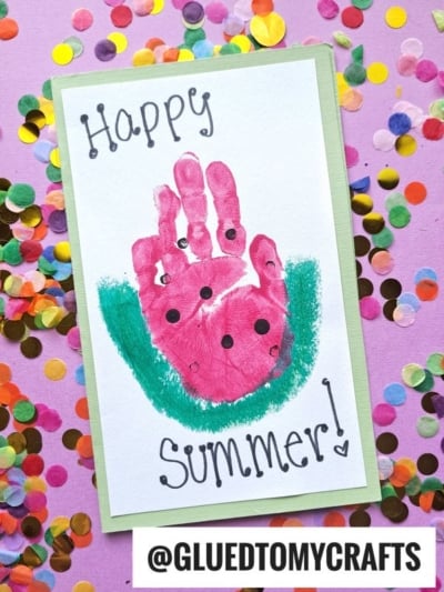 A colorful handprint watermelon card features a pink slice with black seeds and a green rind, "Happy Summer!" above and below, and is surrounded by multicolored confetti.