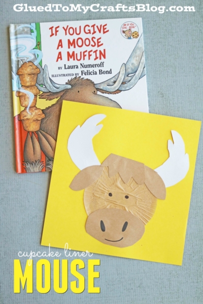A children’s book titled If You Give a Moose a Muffin sits beside a yellow paper featuring a cupcake liner moose craft, made from brown and white liners and paper cutouts. Text reads “cupcake liner moose.”.