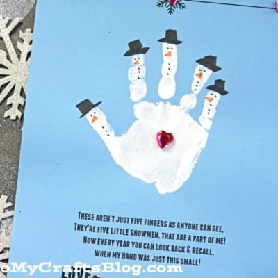 A blue card features a snowman handprint with five snowmen, each in a black hat. The card includes a handprint snowman poem, silver snowflake decorations in the background, and pink heart gems as accents.