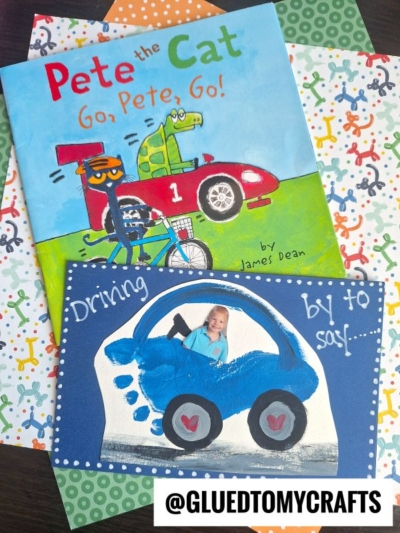 A Pete the Cat book titled Go, Pete, Go! is on colorful paper, next to a blue footprint car card craft featuring a child's photo as the driver and the words Driving by to say!... @GLUEDTOMYCRAFTS is at the bottom.