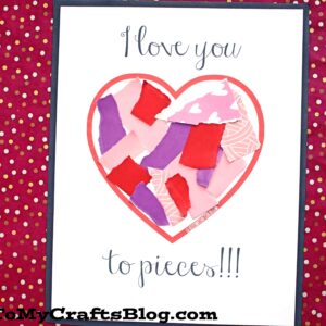 A handmade card on a red and gold polka dot background says love you to pieces and features a heart filled with colorful torn paper scraps. Text at the bottom reads Torn Paper Kid Craft Idea, perfect for an I love you to pieces craft.