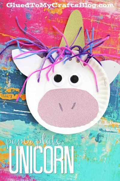 A delightful paper plate unicorn face craft made from a paper plate, yarn for hair, a sparkly horn, and a pink snout, set on a colorful painted background. This charming paper unicorn project is perfect for adding a touch of magic to any creative activity.