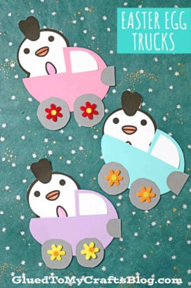 Three paper crafts of cartoon chickens in pastel-colored easter egg trucks with flower wheels are displayed on a teal, star-patterned background. A label in the top right reads Easter Egg Trucks.