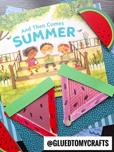 A children’s book titled “And Then Comes Summer” is surrounded by colorful Popsicle Stick Watermelon Slices crafts and a tag that reads @GLUEDTOMYCRAFTS. Three smiling kids and a dog are illustrated on the book cover.