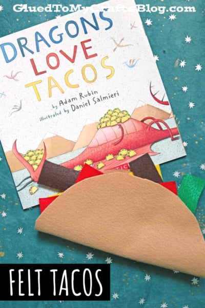 A copy of the book Dragons Love Tacos sits on a star-patterned background with handmade diy felt tacos underneath. White text at the bottom reads, FELT TACOS—perfect for pretend play tacos with your little dragons!.