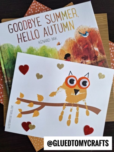 A children’s book titled Goodbye Summer, Hello Autumn sits under a cute Handprint Autumn Owl craft made from an orange handprint, googly eyes, and hearts. The image includes the Instagram handle @GLUETOMYCRAFTS.