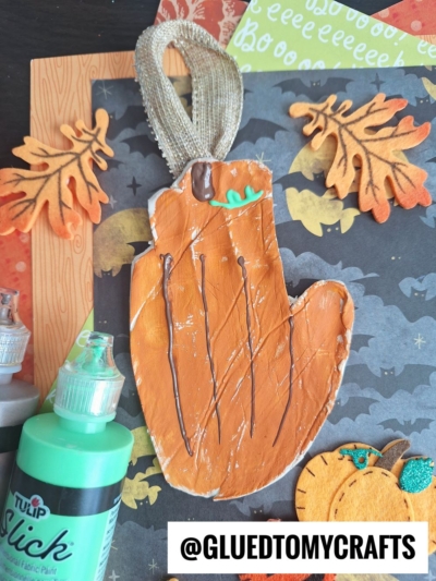 CLAY PUMPKIN ORNAMENT - AFTER MAKING THE HANDPRINT DESIGN IN THE CLAY, USE A KNIFE TO CUT OUT THE DESIGN