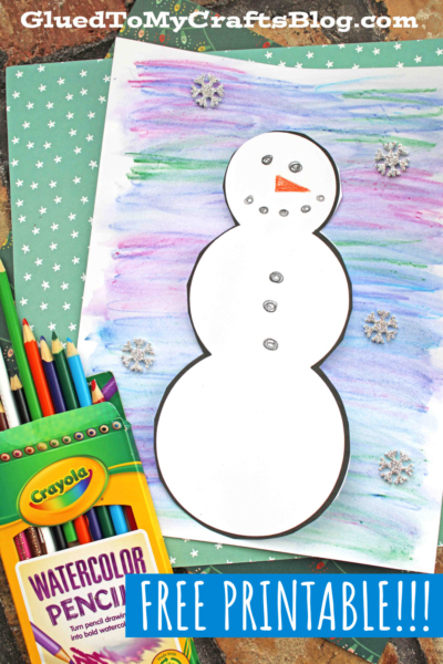 A watercolor snowman outline on a colorful background, decorated with buttons, a carrot nose, snowflake stickers, and surrounded by colored pencils and art supplies. Text: FREE PRINTABLE!!!.