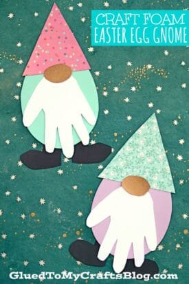 Two Easter egg gnome crafts made from colorful craft foam, with polka dot and floral hats, white handprint beards, and oval noses are displayed on a green star-patterned background—perfect as a cheerful handprint spring gnome project.