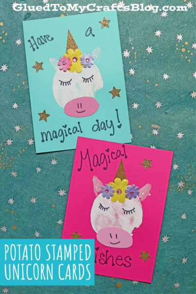 Two handmade stamped unicorn cards with potato-stamped faces, gold glitter horns, flower stickers, and star decorations. One card says Have a magical day! and the other reads Magical wishes.