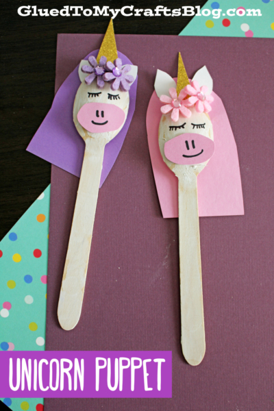 Two unicorn puppets made from wooden craft sticks, inspired by the charm of a wooden spoon unicorn, feature painted faces, paper ears, gold horns, and flower decorations. They're displayed on colorful paper backgrounds with text reading UNICORN PUPPET.