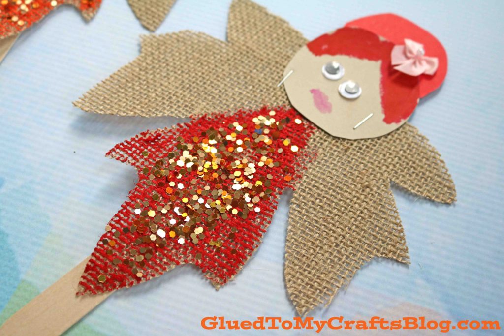 A whimsical Autumn Leaf Fairy puppet craft made by children, featuring colorful fall leaves for wings and a friendly face, designed for a fun and creative kids' activity.