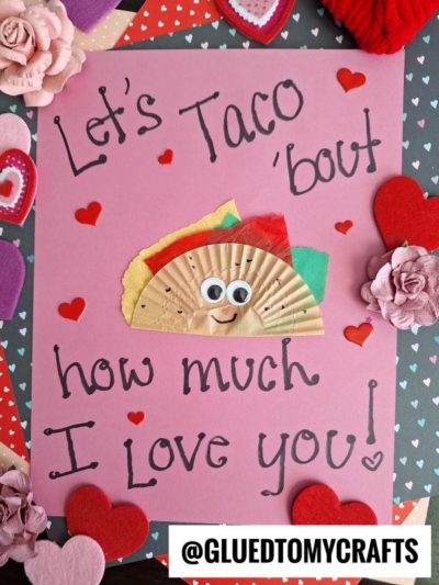 A pink card decorated with paper hearts and flowers features the message "Let’s Taco 'bout how much I love you, friend!" and has a smiling cupcake liner taco. The handle @GLUEDTOMYCRAFTS is at the bottom.