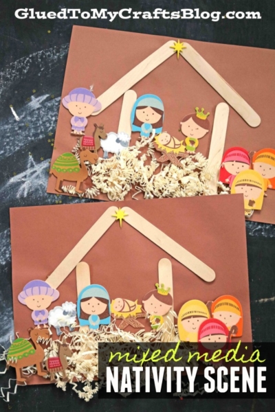 Two handmade nativity scene kid crafts feature paper and popsicle stick stables, cartoon figures of Mary, Joseph, baby Jesus, animals, and the Three Wise Men, with shredded paper for hay on a brown background. Text reads mixed media NATIVITY SCENE.