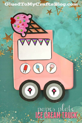 A pink paper plate ice cream truck craft, decorated with black wheels, cute ice cream illustrations, and a large cone on top, sits against a teal background sprinkled with gold stars.