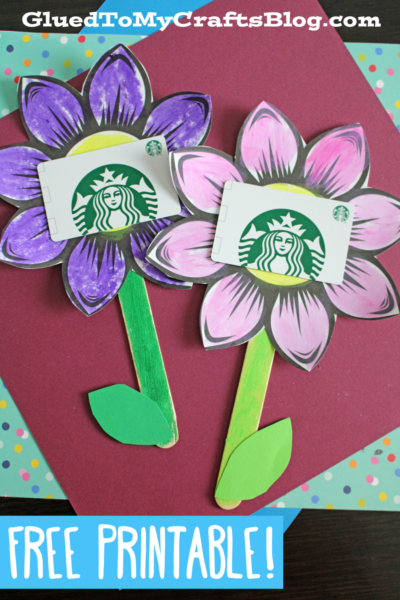 Two colorful paper flower gift card holders, each with a Starbucks gift card in the center, are displayed on a burgundy background. The image promotes a free printable craft from GluedToMyCraftsBlog.com.