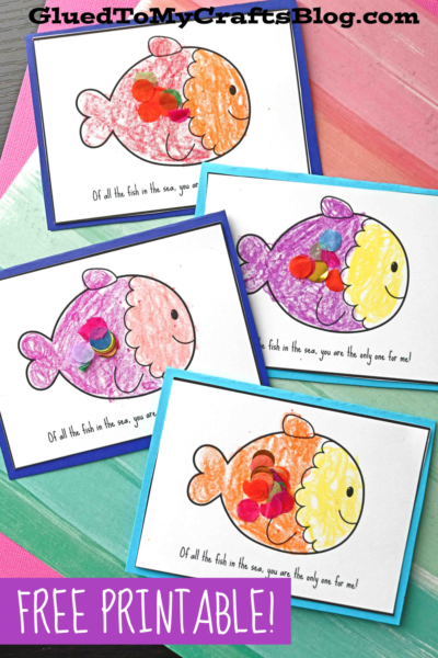 Four handmade cards feature colorful fish with heart-shaped scales, each decorated by hand. This "of all the fish in the sea card" is a charming card for Father's Day. Text says, Of all the fish in the sea, you are the only one for me! FREE PRINTABLE!.