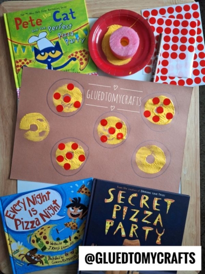 A flat lay of three pizza-themed children’s books, a brown paper with five pizza slice crafts, a plate with toy pizza slices, a sheet of red dot stickers, and hints of pool noodle craft ideas. The handle @GLUEDTOMYCRAFTS is visible at the bottom.