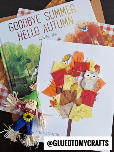 A fall-themed flat lay features the book Goodbye Summer, Hello Autumn, a Tissue Paper Fall Tree with colorful leaves and an owl sticker, a small scarecrow doll, and a @GLUEDTOMYCRAFTS label.