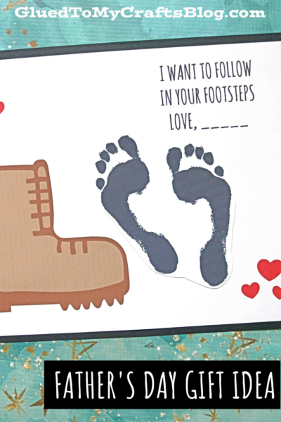A handmade Fathers Day card with a brown boot print, two black child footprints, red hearts, and the text I want to follow in your footsteps love, ______. This unique father's day footprints card makes a heartfelt Fathers Day gift idea.
