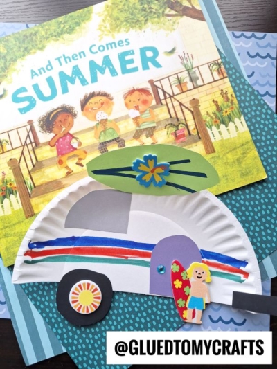 A children’s book titled “And Then Comes Summer” is shown with a colorful paper plate camper craft, made from paper and a cupcake liner, decorated with flowers, stripes, and a drawing of a smiling girl. @GLUEDTOMYCRAFTS is labeled at the bottom.