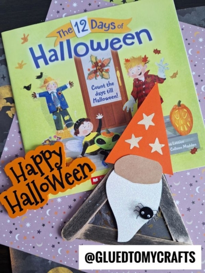 A children’s book called The 12 Days of Halloween, a popsicle stick Halloween gnome craft with an orange hat and spider, an orange “Happy Halloween” sign, and a @gluedtomycrafts tag are displayed together.