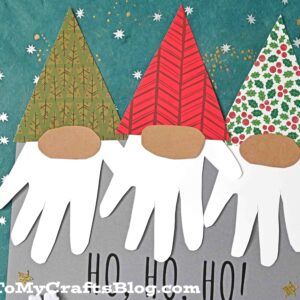 Three paper santa gnomes made from patterned hats, oval noses, and handprint-shaped white beards on a festive background with stars; Ho Ho Ho! is written below—a perfect gnome keepsake for the holidays.
