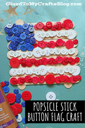 A DIY popsicle stick button flag craft made with popsicle sticks and red, white, and blue buttons to mimic the flag’s stripes and stars, arranged on a green surface with craft supplies around. Text reads “POPSICLE STICK BUTTON FLAG CRAFT.”.