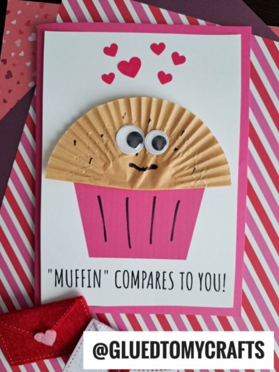 A handmade muffin card for mom features a cupcake liner muffin design with googly eyes, a smiling face, and hearts above. The text reads, MUFFIN compares to you! Set on pink striped paper with heart decorations.