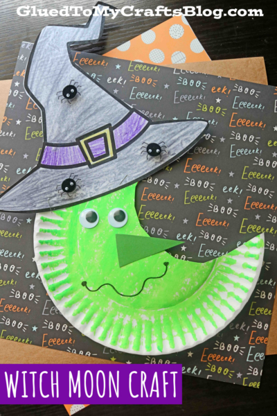 A Halloween craft featuring a paper plate witch moon with googly eyes, a witch hat, and a big smile, displayed on festive Eek! patterned paper. Text reads Witch Moon Craft and GluedToMyCraftsBlog.com.
