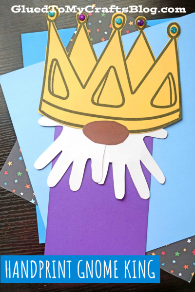A colorful craft features a handprint king gnome with a gold crown and white beard, made from paper and decorated with gems, set on colored and patterned paper. Text reads HANDPRINT GNOME KING.