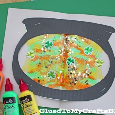 A colorful Paint Splat Leprechaun Cauldron craft is shaped like a leprechaun’s pot, adorned with shamrock and star confetti.