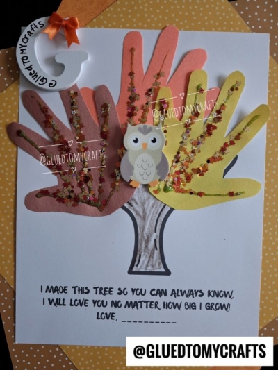 A beautiful handprint tree keepsake is crafted from orange, yellow, and brown paper handprints, adorned with glitter, a cute paper owl, and a handwritten note about growth and love. Social media handles for @GLUEDTOMYCRAFTS are also visible.