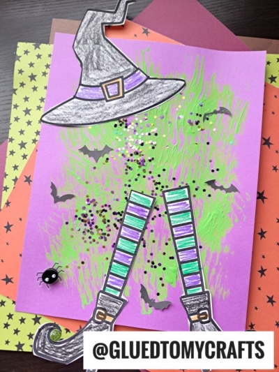 A Halloween craft features a fork painted melted witch hat, legs, bats, sparkles, and a spider on colorful paper. The @GLUEDTOMYCRAFTS handle is visible at the bottom.
