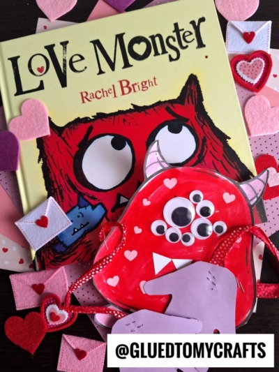 A “Love Monster” book with a red handprint love monster and googly-eyed red monster craft, surrounded by felt hearts. The Instagram handle @GLUEDTOMYCRAFTS is displayed at the bottom.